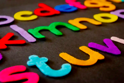 A closeup of a group of felt letters