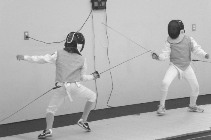 Two young fencers during a bout