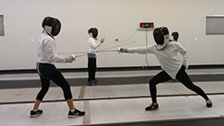 A group of children participating in fencing lessons